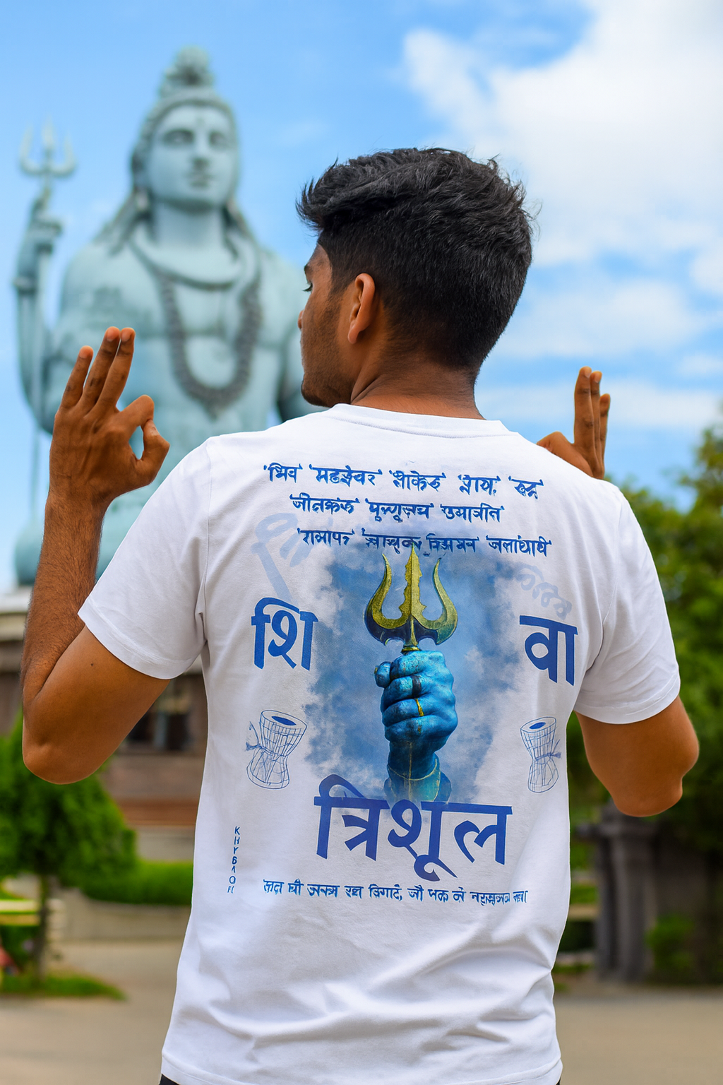 Person wearing a white t-shirt with blue Shiva design and text, standing in front of a statue.

White oversize T-shirt 240 GM 100% cotton, Krypton Studio India Online